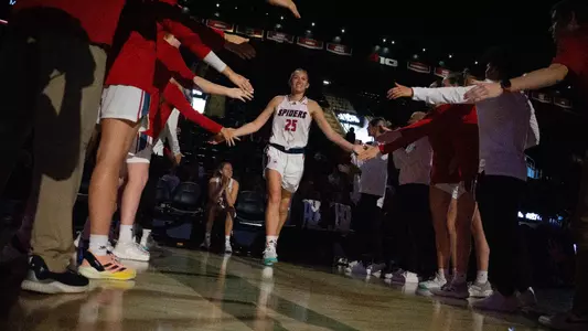 Katie Hill running through player tunnel pregame
