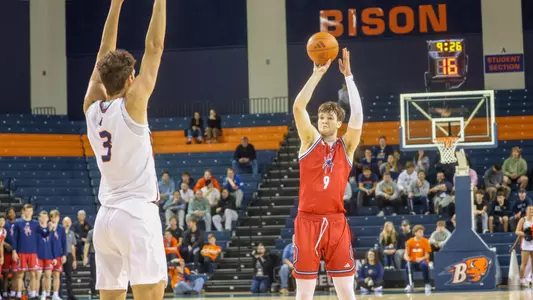 Jonathan Beagle shoots a three-pointer at Bucknell