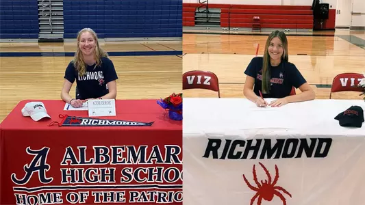 Addie Doroh (L) and Avery McLaughlin (R) sign letters to attend the University of Richmond