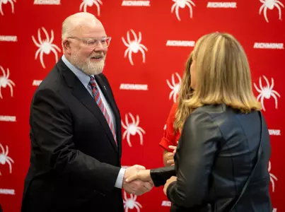 John Hardt shakes hands at the Hall of Fame dinner
