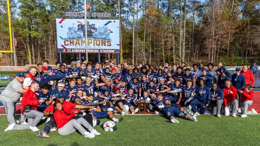 The Richmond football team posing as 2024 CAA Champions