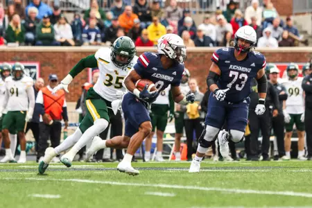 Andrew King carries the ball during Richmond's 27-0 win over William & Mary on Nov. 23, 2024