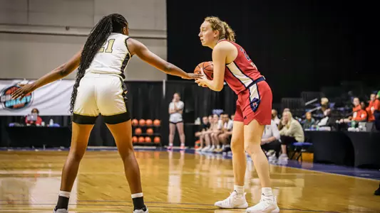 Addie Budnik about to pass the ball