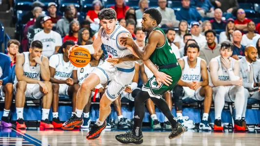 Jack Graham drives past his Mount Olive defender on the baseline