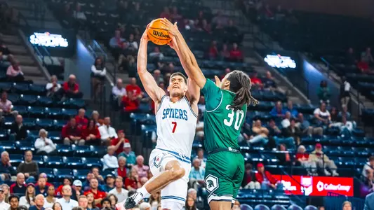 Dusan Neskovic goes in for a layup against Mount Olive
