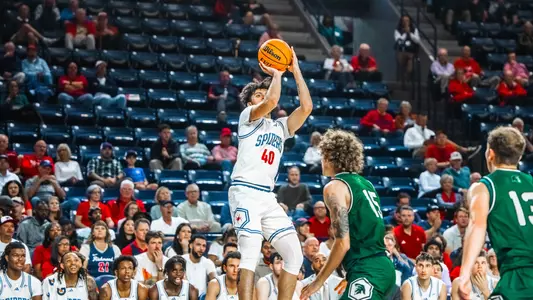 George Washington III shoots a jump shot