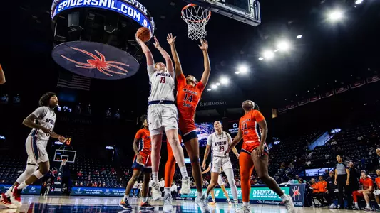 Sam Dewey scoring a layup ove ra Morgan State player