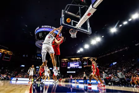 Apostolos Roumoglou finishes a layup over a Marist defender