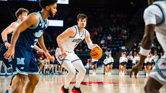 Jonathan Beagle dribbles left from the elbow at the Robins Center