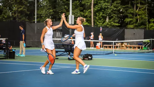 Lainey O'Neil and Lucy Webber high fiving