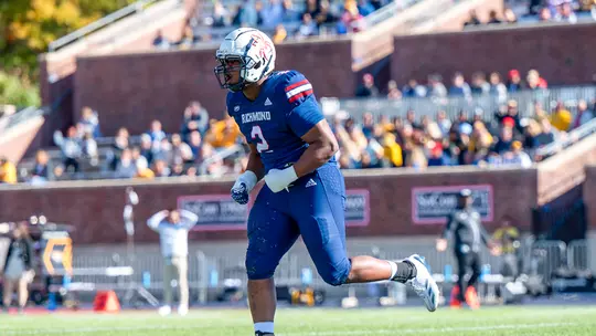 Jeremiah Grant celebrating a tackle against Towson
