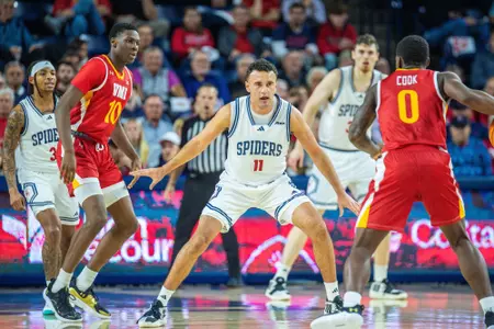 Jason Roche defends a VMI player at the top of the key