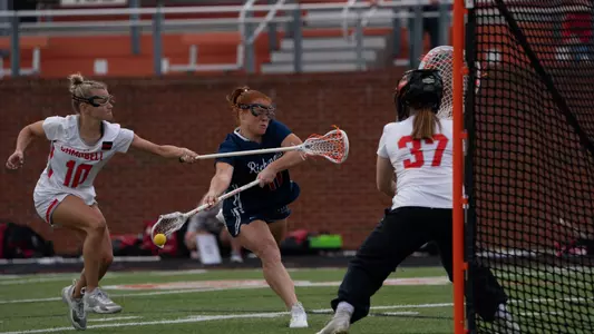Colleen Quinn dodging past a Campbell defender taking the low shot for a goal