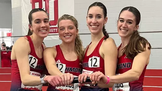 From left to right; Elizabeth Stockman, Virginia Beringer, Caroline Donohoe and Madison Trippett posing with the baton after setting a new program record in the DMR at David Hemery Valentine Invitational in Boston