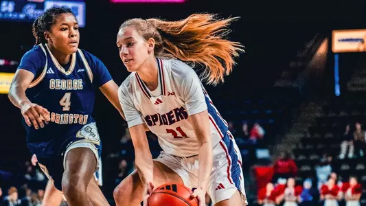Kylee Lewandowski holding the ball during a game