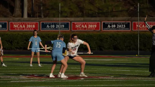 Clare McCooe in the draw circle going up against an Old Dominion player