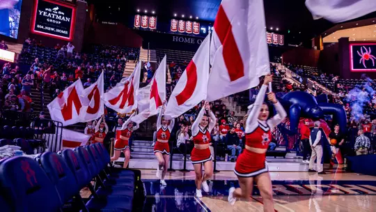 General Cheerleaders running out with flags spelling Richmond pregame
