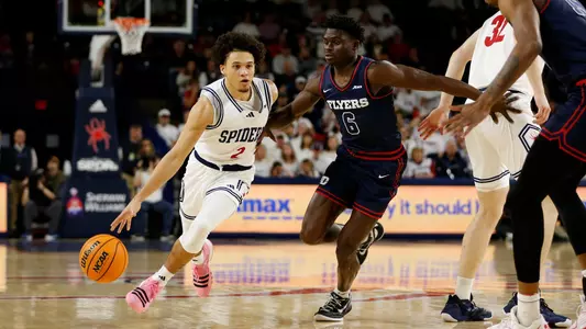 Jordan King drives to his right through the lane vs Dayton