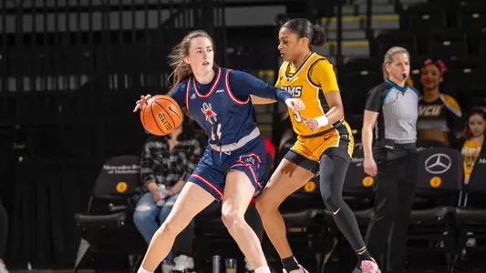 Maggie Doogan posting up against a VCU defender