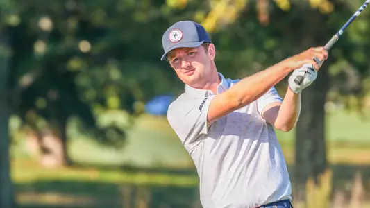 Patrick Isztwan holds his follow-through during a practice swing