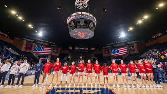 Photo of all Women's Basketball Players and coaches pregame
