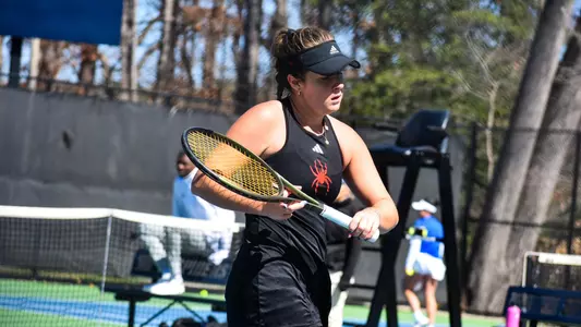 Elizabeth Novak walking to the serving line