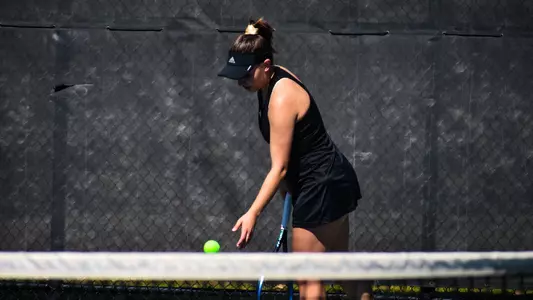 Claire Le Du serving the ball