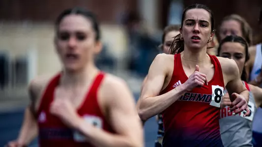 Elizabeth Stockman racing and staring straight ahead with an intense face