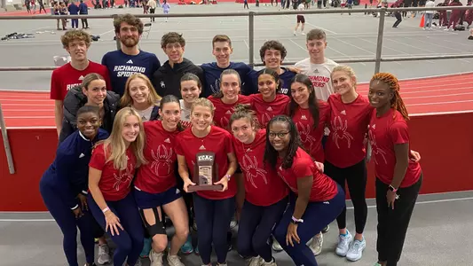 Combined team photo of mens cross country team and women's track and field team at ECAC/IC4A Indoor championships