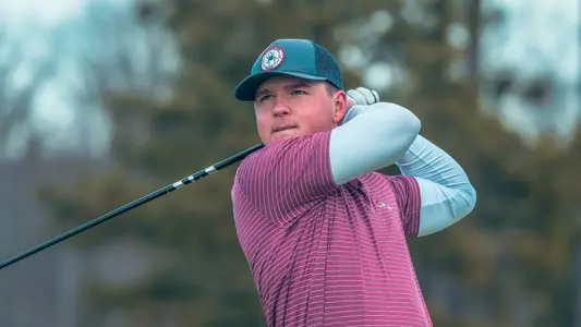 Owen Pearce stares down his tee shot with his driver
