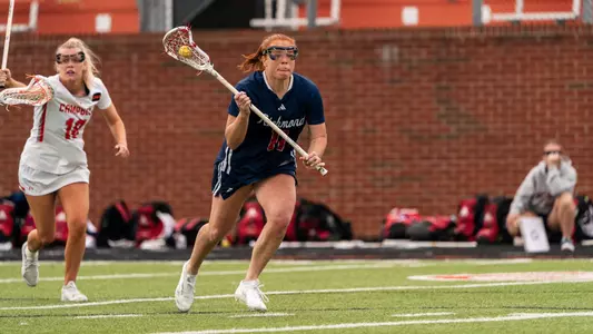 Colleen Quinn running towards the goal ready to shoot the ball