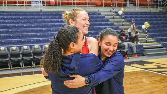 Anabella and Isabella Paelez hugging Katie Hill