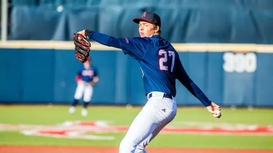 Matthew Anderson is mid-pitching motion, rares back to throw the ball