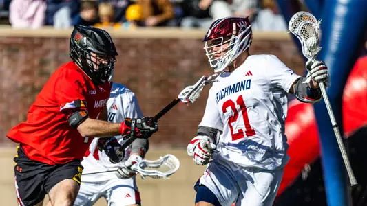 Dalton Young works past a Maryland defender during Richmond's 12-11 double overtime loss to the Terrapins on February 3, 2024