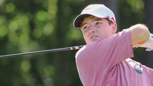 A tight shot of Quin Polin holding his follow through after hitting a drive