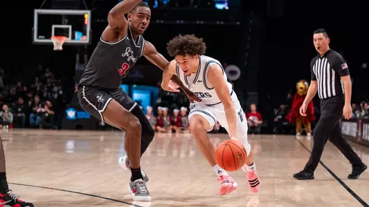 Jordan King drives left past a Saint Joseph's defender