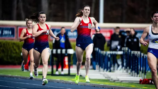 Allison Colflesh with a determined face as she looks to cross the finish line in a short distance event
