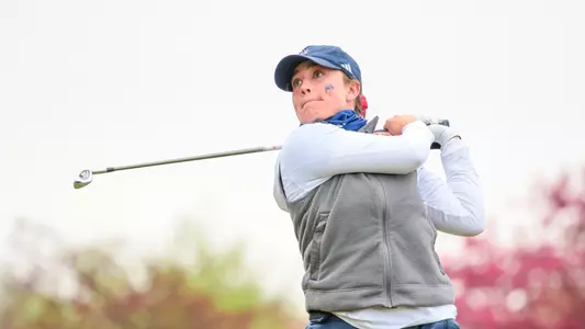 Rory Weinfurther holds her follow through following an iron tee shot