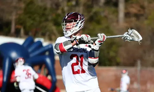 Dalton Young looks to make a pass during Richmond's game against Virginia on Saturday, February 17, 2024