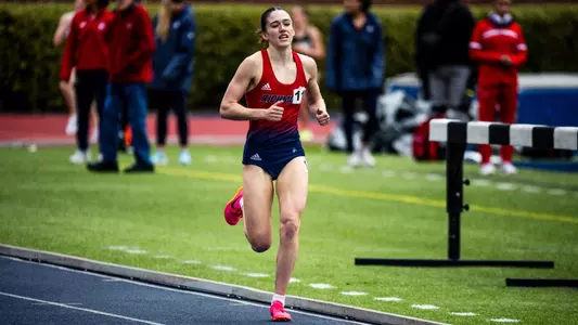 Madison Trippett about to cross the finish line on the track