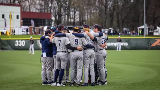 A pregame huddle for the position players of Spider Baseball