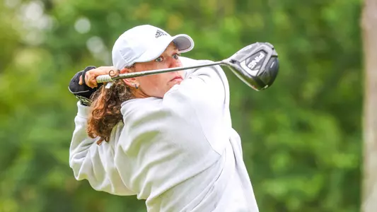 Hannah Lydic stares down her teeshot as it travels down the fairway