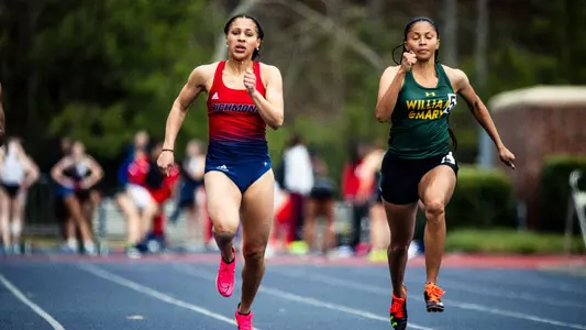 Nina Lavelle running with intensity towards the finish line