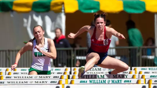 Alexandra Cahill jumping over a hurdle