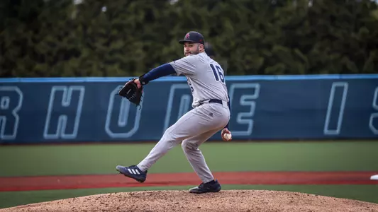 Esteban Rodriguez strides forward off the mound to throw the ball towards home plate.