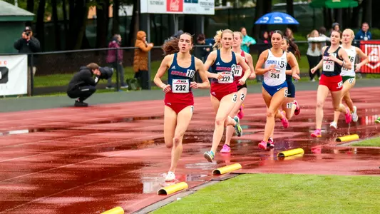 Elizabeth Stockman and Dylan Miller make the turn during a 1,500 M race