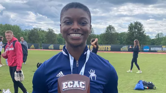 Alicia Dawson holding her Performer of the Meet trophy after the 2024 Outdoor ECAC Championships