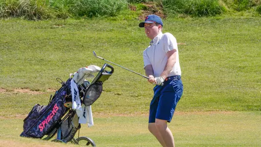 Quin Polin stares down his chip while holding his follow-through