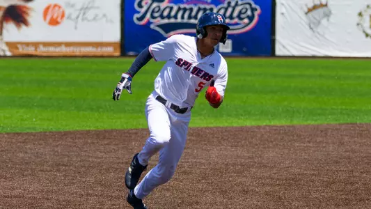 Aaron Whitley runs towards third base in the first game of the Atlantic 10 Conference Tournament
