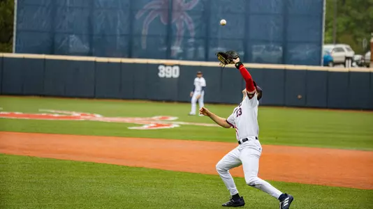 Jordan Jaffe catches a pop up at first on the infield grass